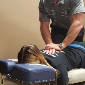 Chiropractor giving chiropractic adjustment care in des moines, ia