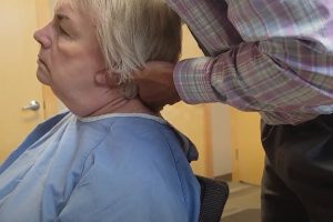 Neck adjustment for pain relief at hassel family chiropractic